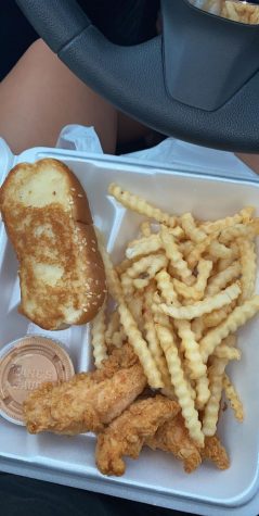 Canes three-piece chicken meal. This inlcudes chicken, bread, fries, and the classic Canes sauce.