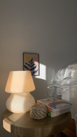 Minimalistic nightstand decor along with a simple wall art print.