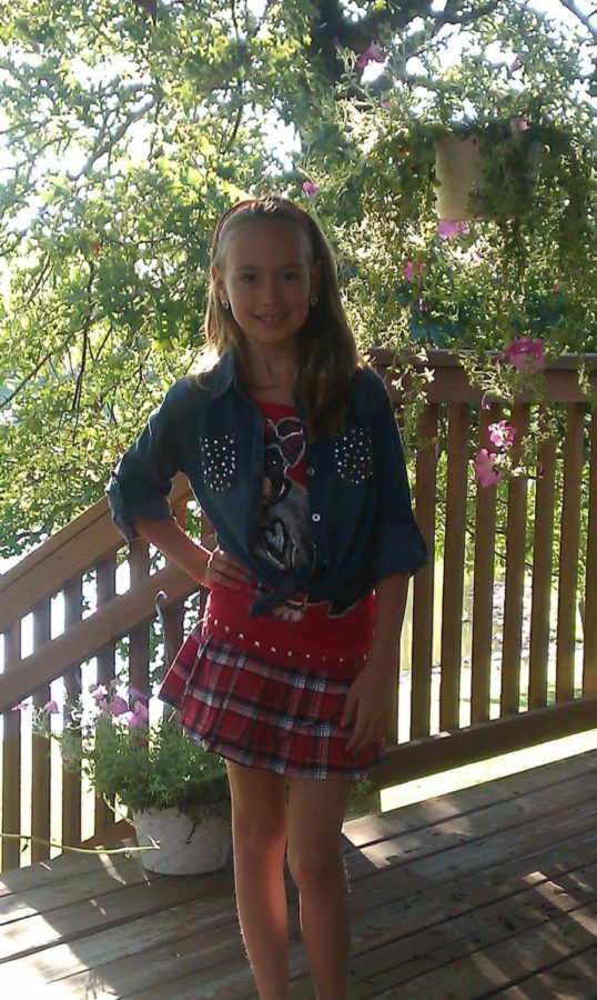 Eight-year-old Kenzie Peterson poses in her Justice outfit.