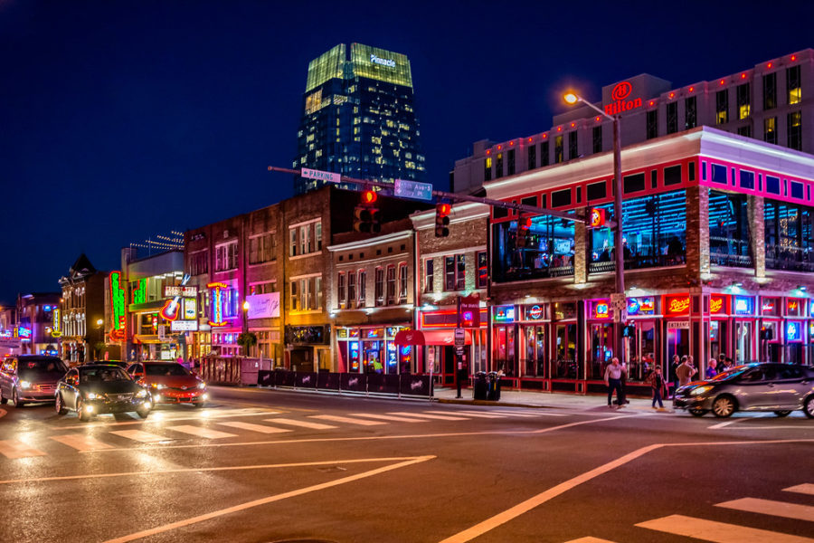 Photo of down town Nashville at night.