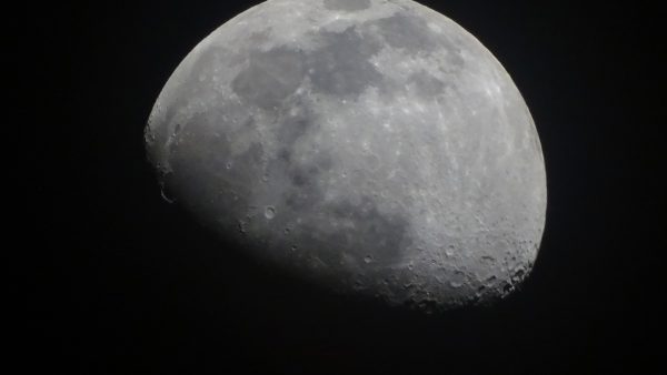 Close up photo of the moon and some of its craters.