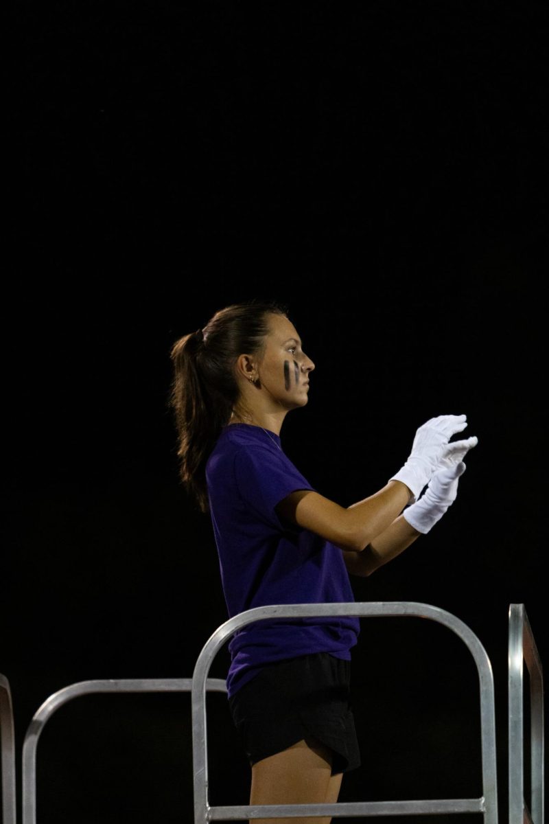 Lauren Tracy as drum major during a football game.