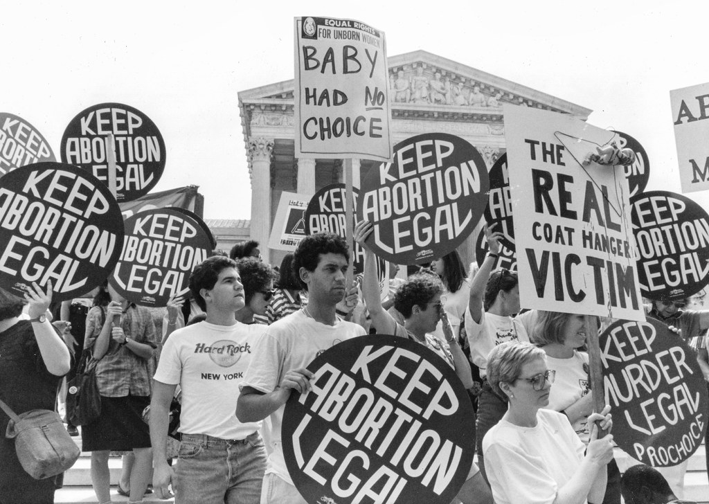 Pro and anti abortion protestors outside the Supreme Court.