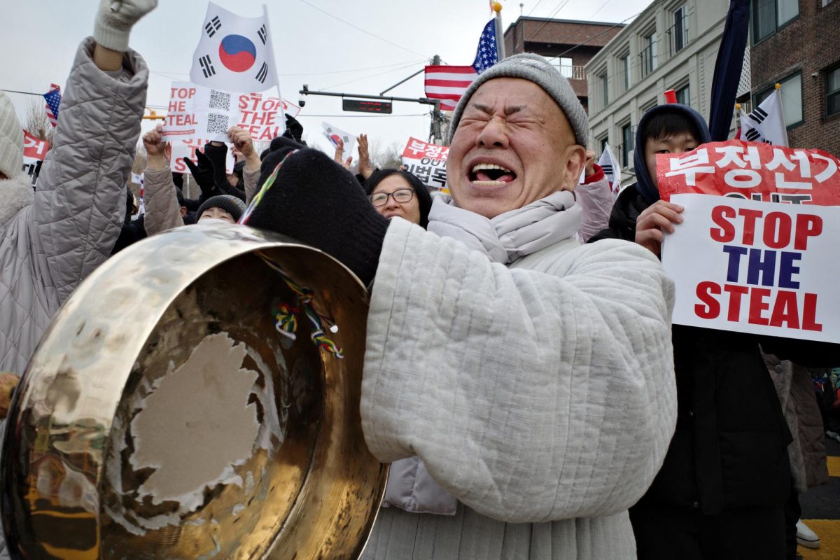 Supporters of impeached South Korean president Yoon Suk Yeol react during a rally near his residence in Seoul on January 6, 2025. 