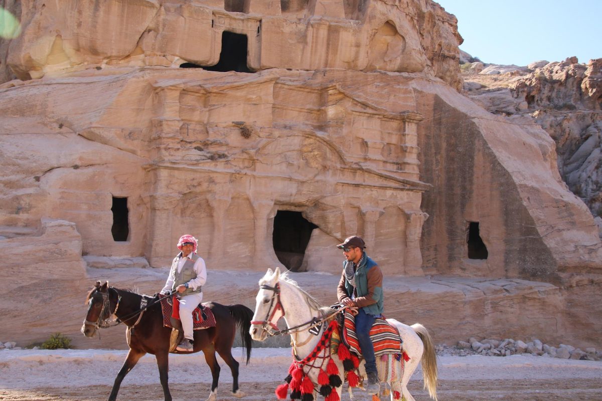 Horsemen, shown here passing the Obelisk Tomb, will bring visitors a short distance to the beginning of the Siq in Petra.